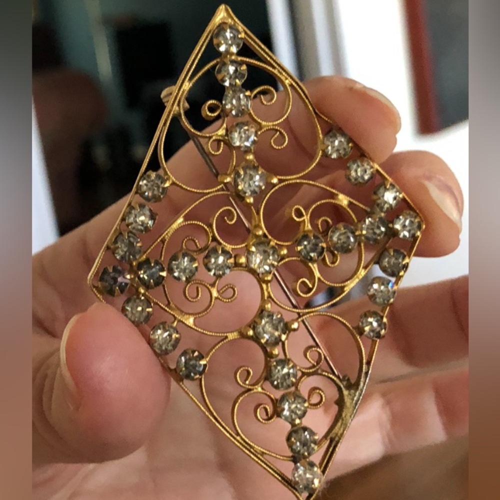 Antique Gold plated Brooch, covered in Rhinestones .